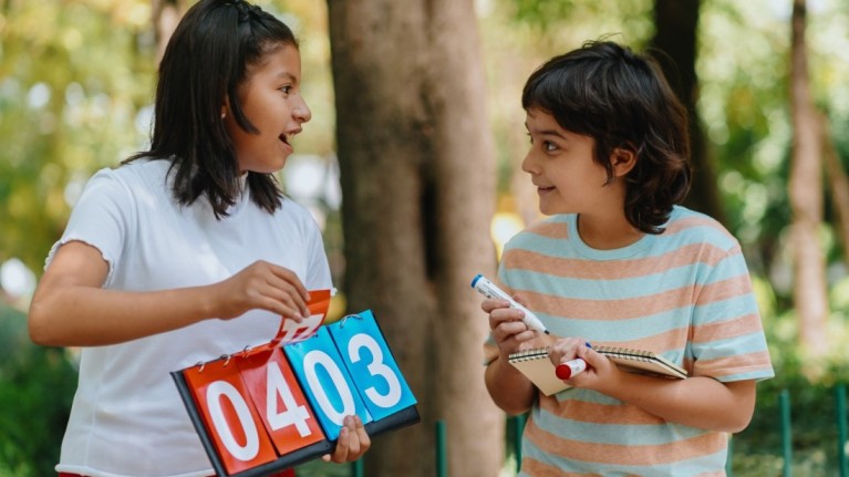 Children Writing And Counting Game Scores